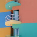 Bright colorful building with modern balconies in Portugal's vibrant architecture.