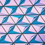 A vibrant triangular pattern with shades of pink and blue for modern backgrounds.